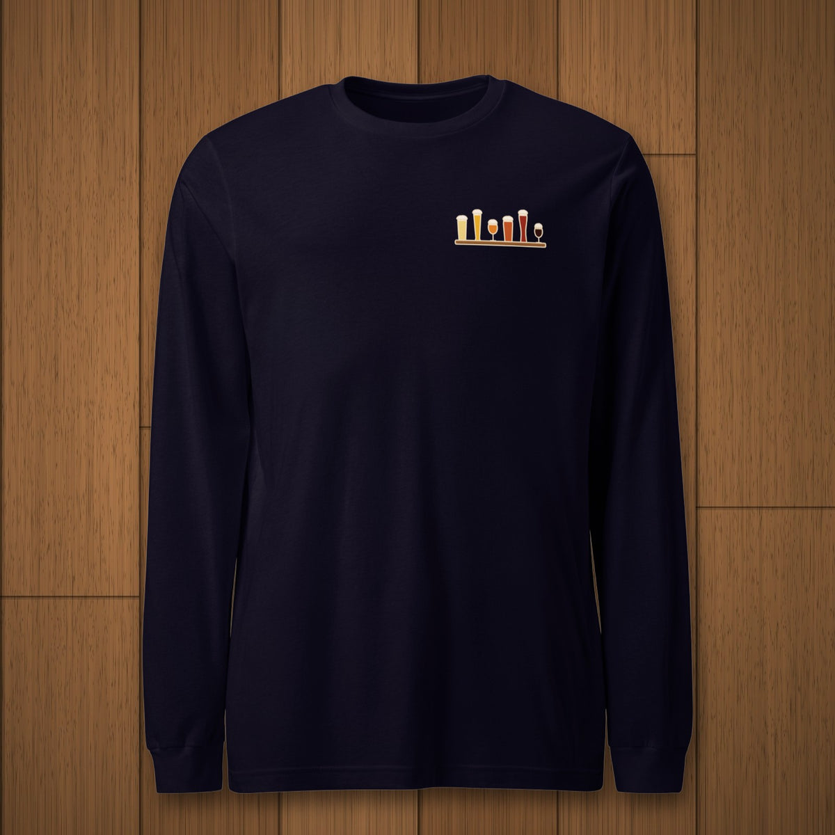 Christmas Flight 2026 Long Sleeve T-Shirt in Navy laid flat on oak boards