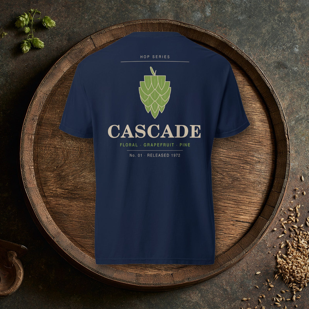 Back of the Hop Series Cascade T-Shirt in True Navy with a green hop cone on an oak barrel top