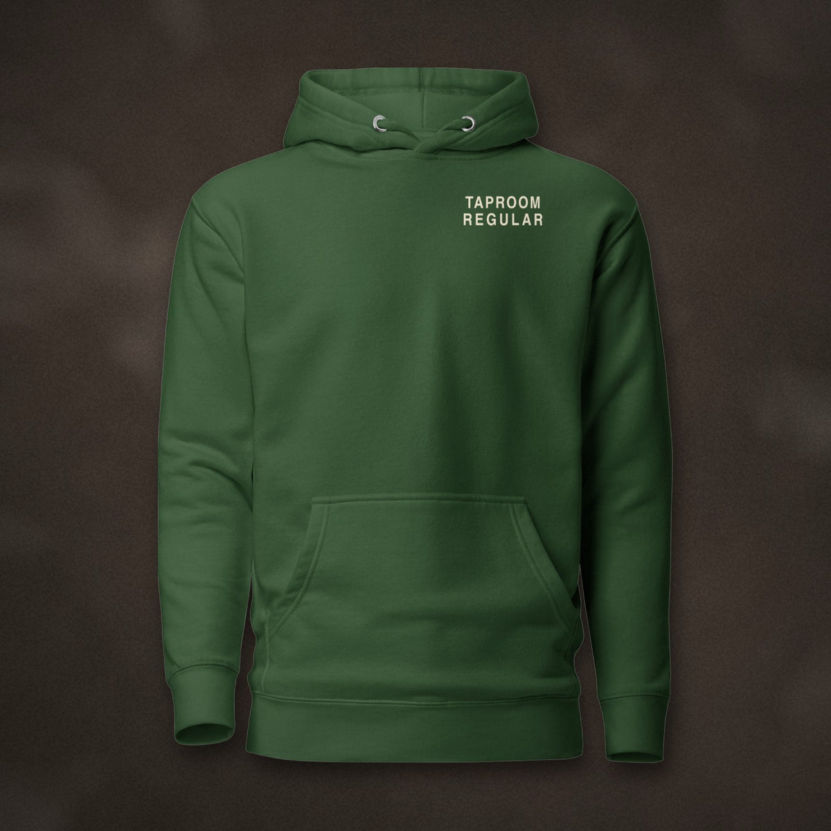 Taproom Regular Hoodie in Forest Green laid flat on dark slate
