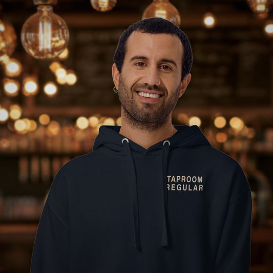 Man wearing the Taproom Regular Hoodie in Navy Blazer in a taproom