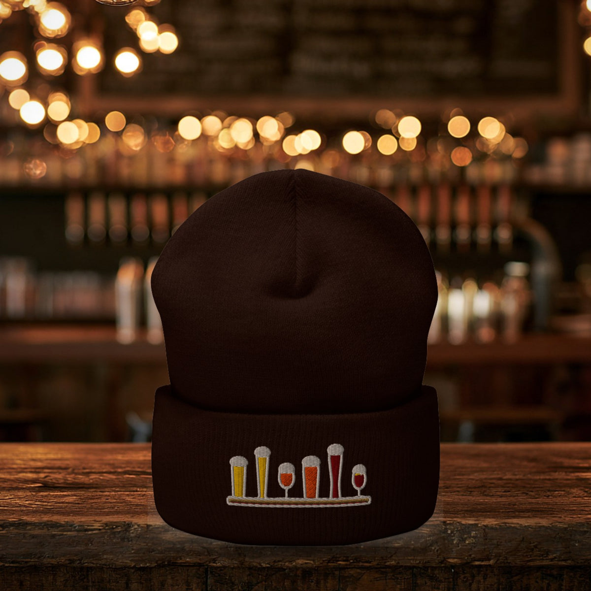 Winter Flight Embroidered Cuffed Beanie in Brown on the bar