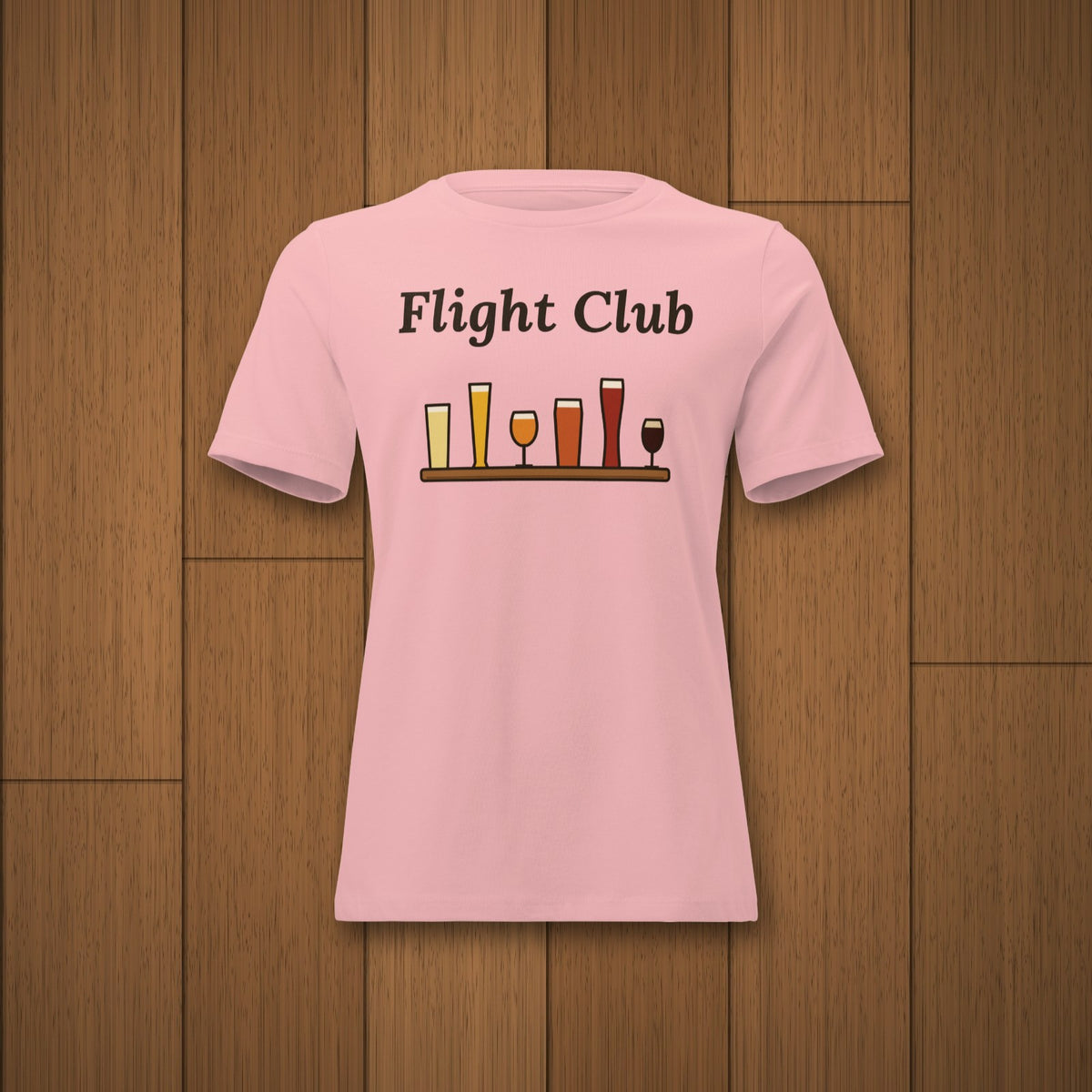 Women's Flight Club Relaxed T-Shirt in Pink laid flat on oak boards