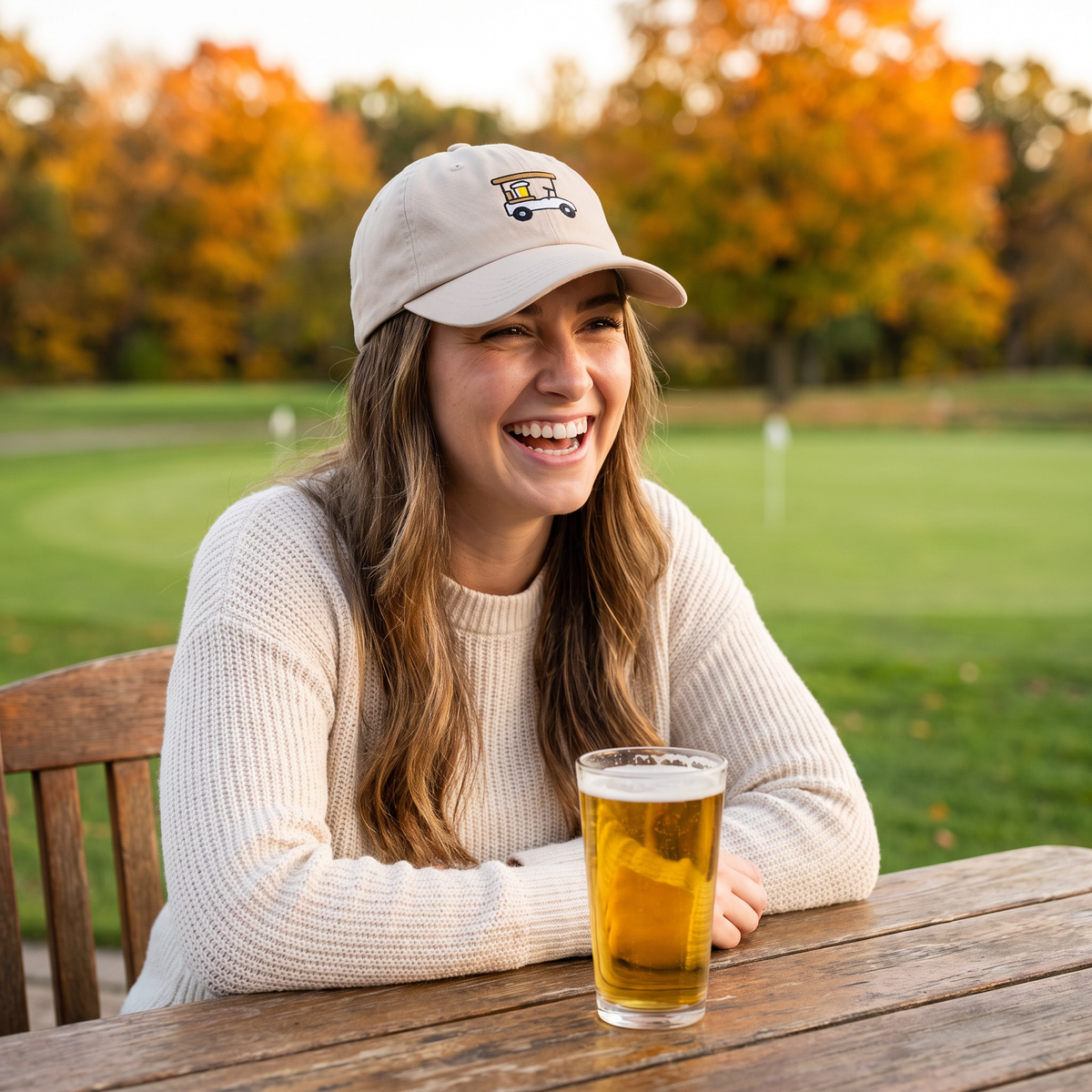 Woman wearing the Designated Driver Embroidered Golf Dad Hat in Stone on a clubhouse patio